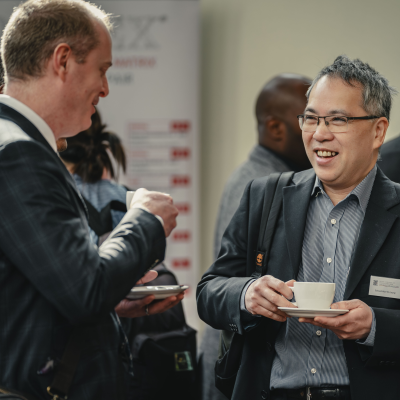 People chatting at a conference